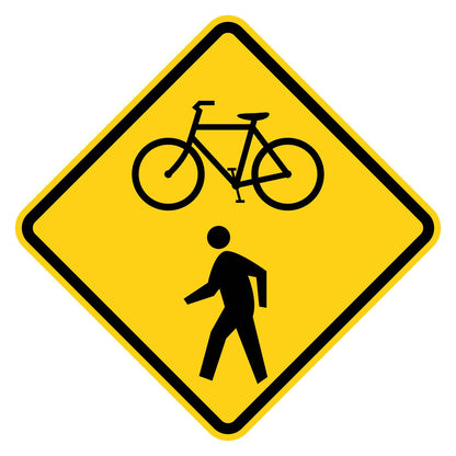 Yellow diamond W11-15 Bicycle and Pedestrian Crossing sign with black symbols and border.