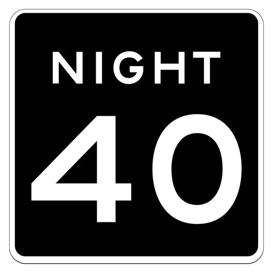 Black square sign with white "NIGHT 40" text, indicating a lower nighttime speed limit.