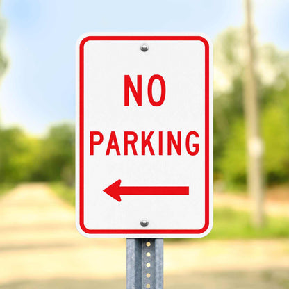 White 12x18 "NO PARKING" sign with red text and a left arrow, mounted on a metal post.