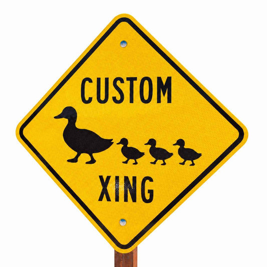 Custom Diamond Crossing Sign With Symbol - example yellow diamond sign reading CUSTOM XING with a duck and three ducklings