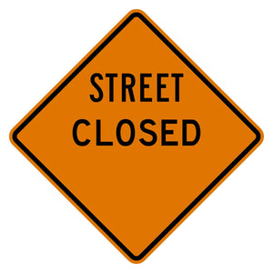 Orange diamond "Street Closed" sign with a blank distance area, black text, and border.