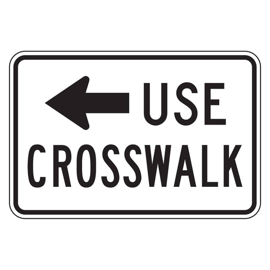 White 18"x12" retroreflective sign with black "USE CROSSWALK" text and a left-pointing arrow.