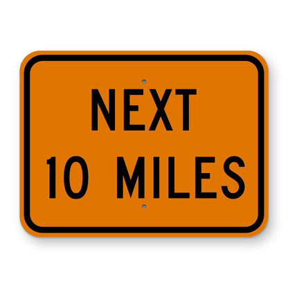 Construction Next 10 Miles Plaque W7-3aP - orange rectangular plaque reading NEXT 10 MILES in black