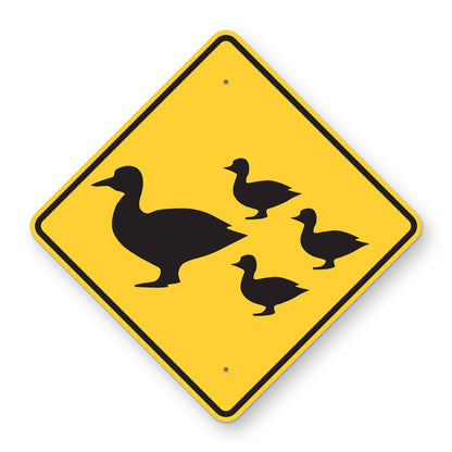 Duck Crossing Symbol Sign - yellow diamond sign with a black mother duck and three ducklings symbol