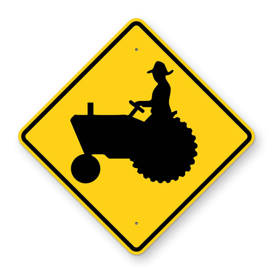 Farm Machinery Warning Sign W11-5 - yellow diamond sign with a black farm tractor and driver