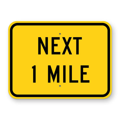 Next 1 Mile Plaque W7-3aP - yellow rectangular plaque reading NEXT 1 MILE in black