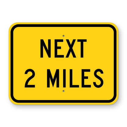 Next 2 Miles Plaque W7-3aP - yellow rectangular plaque reading NEXT 2 MILES in black