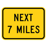 Next 7 Miles Plaque W7-3aP - yellow rectangular plaque reading NEXT 7 MILES in black