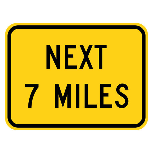 Next 7 Miles Plaque W7-3aP - yellow rectangular plaque reading NEXT 7 MILES in black