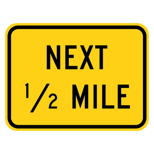 Next 1/2 Mile Plaque W7-3aP - yellow rectangular plaque reading NEXT 1/2 MILE in black