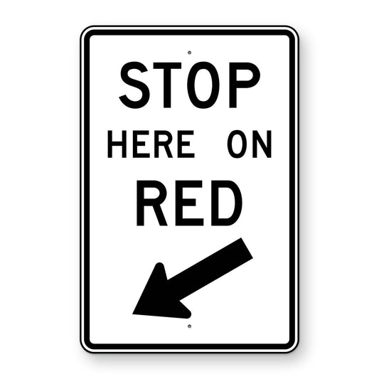 Stop Here on Red Left Arrow Sign R10-6L - white vertical rectangle sign reading STOP HERE ON RED with a black arrow pointing down and to the left