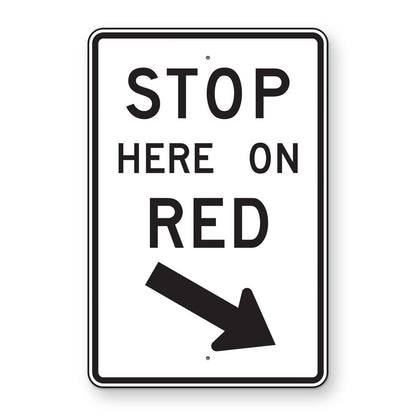 Stop Here on Red Right Arrow Sign R10-6R - white vertical rectangle sign reading STOP HERE ON RED with a black arrow pointing down and to the right