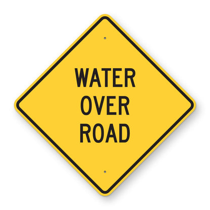 Water Over Road Sign - yellow diamond sign reading WATER OVER ROAD in black