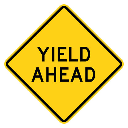Yellow diamond-shaped W3-2A warning sign with black YIELD AHEAD legend.